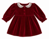 Red velvet dress with white collar on a white background