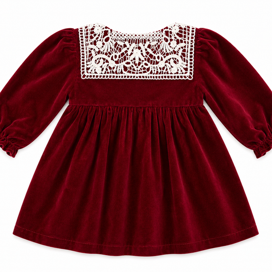 Red dress with lace detailing on a white background