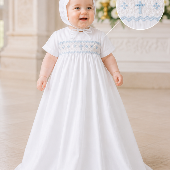 Baby in a white baptism gown with blue embroidery in a church setting