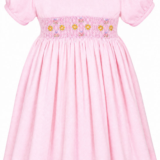 Carriage Boutique pink cotton toddler dress with white collar and smocked yellow floral embroidery detail