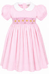 Carriage Boutique pink cotton toddler dress with white collar and smocked yellow floral embroidery detail