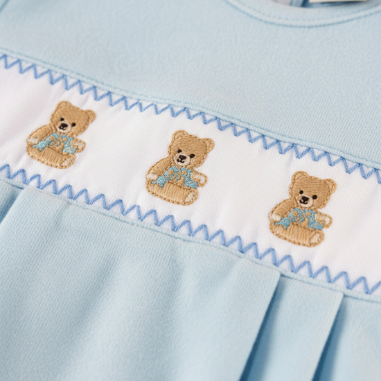 Light blue dress with embroidered teddy bears and decorative trim