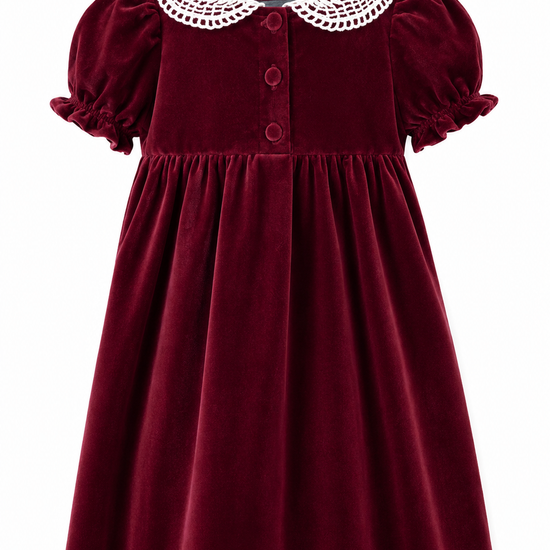 Maroon velvet dress with white lace collar on a white background