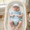 Carriage Boutique baby boy light blue bubble romper with train smocking and matching hat.