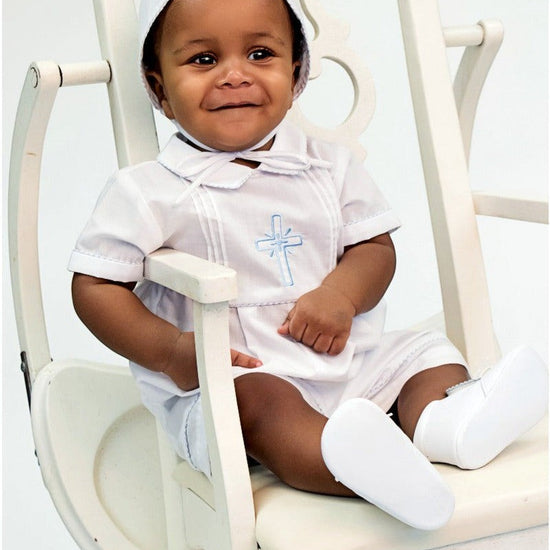 Carriage Boutique baby boy white cotton christening bobby suit with blue smocked cross, matching bonnet, and booties.