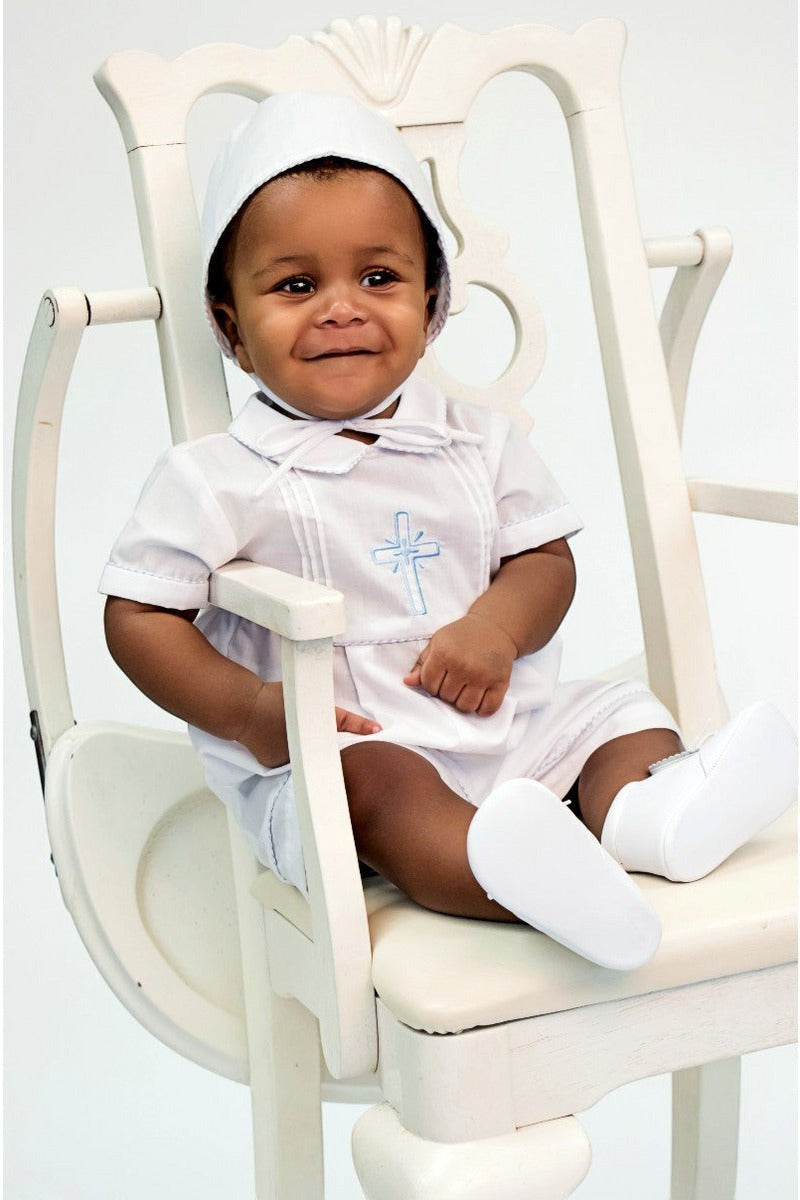 Carriage Boutique baby boy white cotton christening bobby suit with blue smocked cross, matching bonnet, and booties.