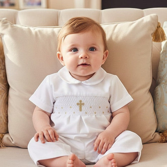 Carriage Boutique baby boy white christening longall with hand-smocked gold cross detail and matching bonnet.