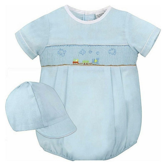 Carriage Boutique baby boy sky blue smocked bubble romper with train embroidery and matching hat.