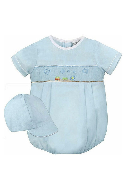 Carriage Boutique baby boy sky blue smocked bubble romper with train embroidery and matching hat.