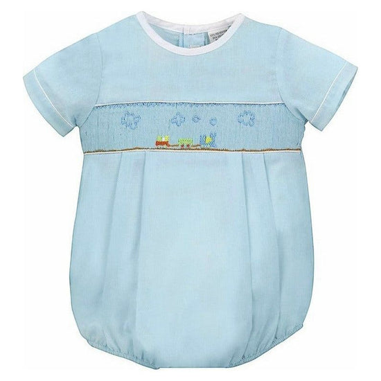 Carriage Boutique baby boy sky blue smocked bubble romper with train embroidery and matching hat.