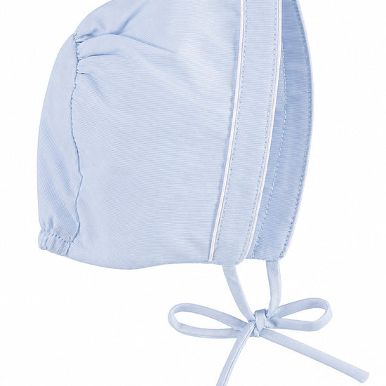 Carriage Boutique light blue baby boy bonnet with subtle shadow texture and white piping trim for Easter celebrations.