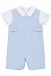 Carriage Boutique baby boy shortall romper in light blue cotton with a white collared shirt and button details.
