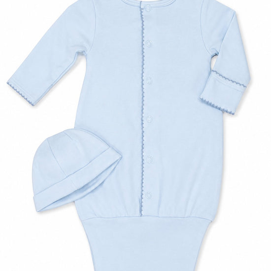 Carriage Boutique blue newborn sleep sack with matching hat, featuring long sleeves and elegant scalloped trim.