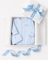 Carriage Boutique blue newborn sleep sack with matching hat and personalized embroidery in a gift box.
