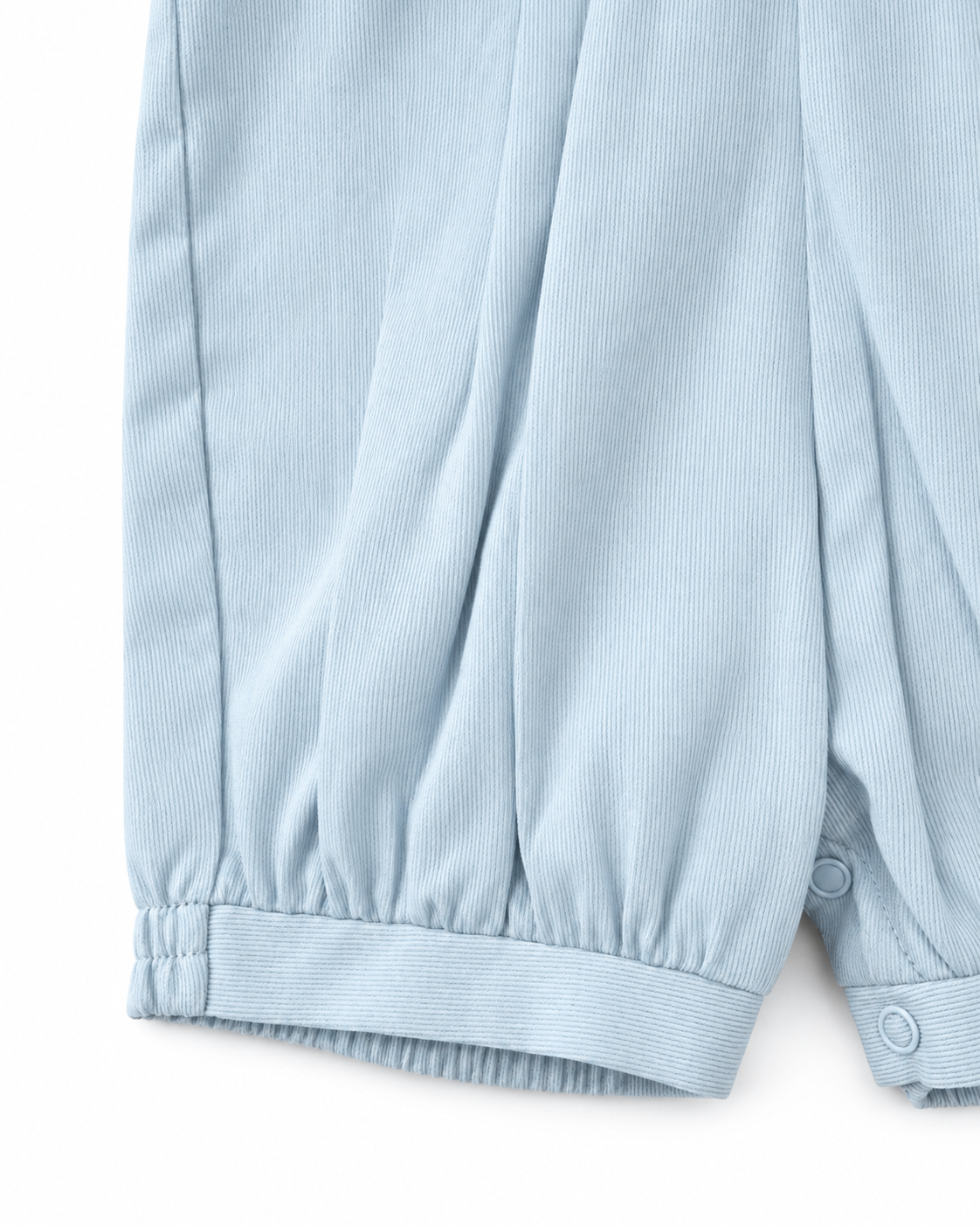 Carriage Boutique baby boy romper in light blue pique fabric with gathered leg cuffs and snap button detailing.