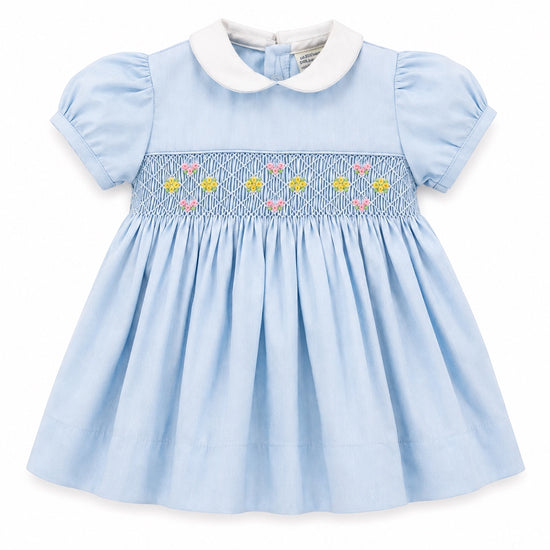 Carriage Boutique baby girl blue dress with white peter pan collar and hand-smocked floral waist detail