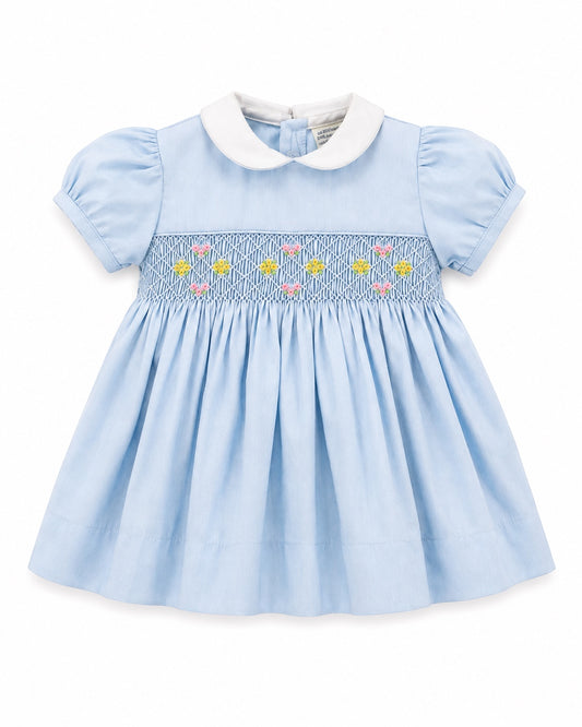 Carriage Boutique baby girl blue dress with white peter pan collar and hand-smocked floral waist detail