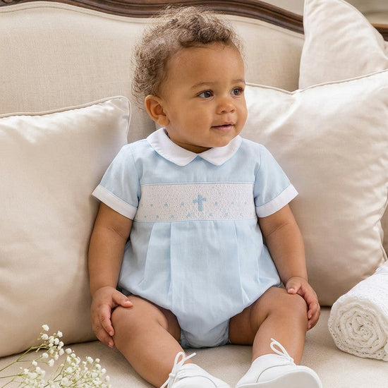 Carriage Boutique baby boy blue cotton bubble romper with hand-smocked cross detail and white Peter Pan collar