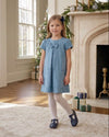 Carriage Boutique blue suede toddler party dress with floral pattern, short sleeves, and a decorative chest ribbon.