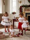 Carriage Boutique boys white batiste shortall with hand-smocked holiday wreath detail for festive seasonal wear.