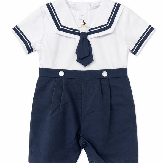 Carriage Boutique boys nautical bobby suit with white cotton shirt, navy sailor collar, tie, and matching shorts.