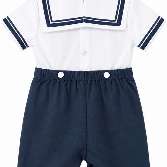 Carriage Boutique boys nautical bobby suit with white shirt, navy sailor collar, and matching navy cotton shorts.