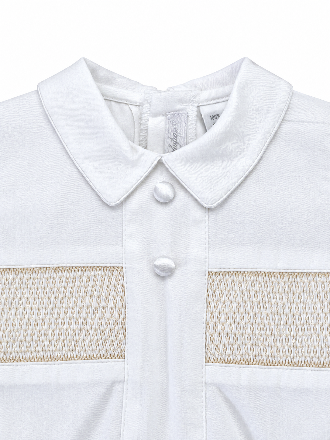 Carriage Boutique white boys bobby suit shirt with hand smocked detailing, Peter Pan collar, and satin buttons.