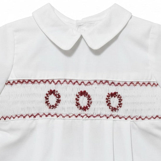 Carriage Boutique white batiste boys shortall with hand-smocked red holiday wreath embroidery and Peter Pan collar