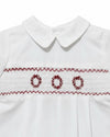 Carriage Boutique white batiste boys shortall with hand-smocked red holiday wreath embroidery and Peter Pan collar