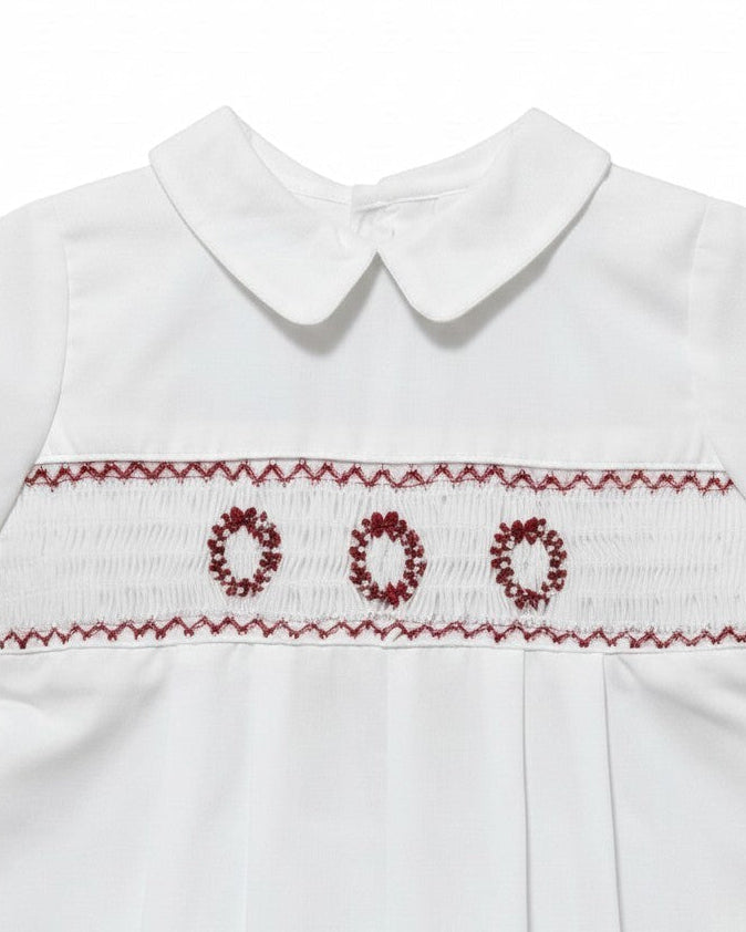 Carriage Boutique white batiste boys shortall with hand-smocked red holiday wreath embroidery and Peter Pan collar