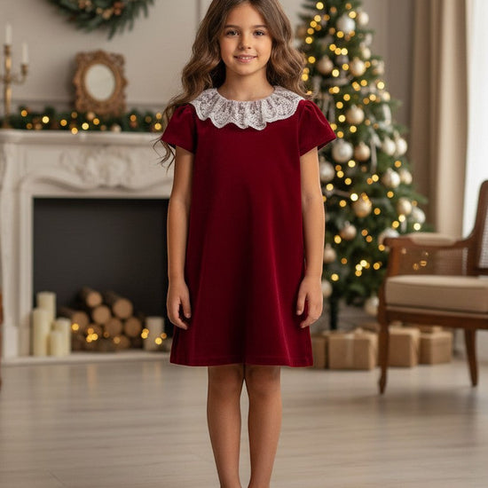 Carriage Boutique toddler burgundy velvet dress featuring a delicate white lace collar, worn by a young girl.