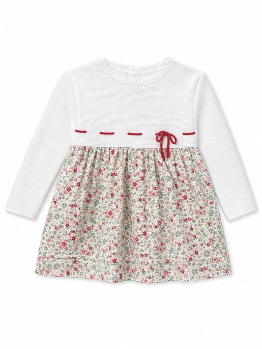 Carriage Boutique long sleeve baby dress with white knit bodice, lace collar, and floral print skirt with red bow.