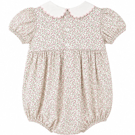 Carriage Boutique baby girl bubble romper in tan floral cotton with puff sleeves, white collar, and pink trim.