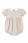 Carriage Boutique baby girl bubble romper in tan floral cotton with puff sleeves, white collar, and pink trim.