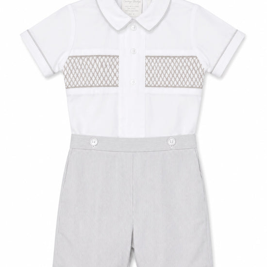 Carriage Boutique gray smocked bobby suit in cotton with a Peter Pan collar and delicate chest embroidery.