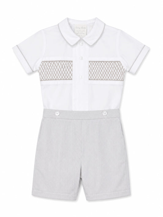 Carriage Boutique gray smocked bobby suit in cotton with a Peter Pan collar and delicate chest embroidery.