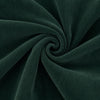 Carriage Boutique dark green cotton corduroy fabric with a soft ribbed texture in a spiral swirl pattern