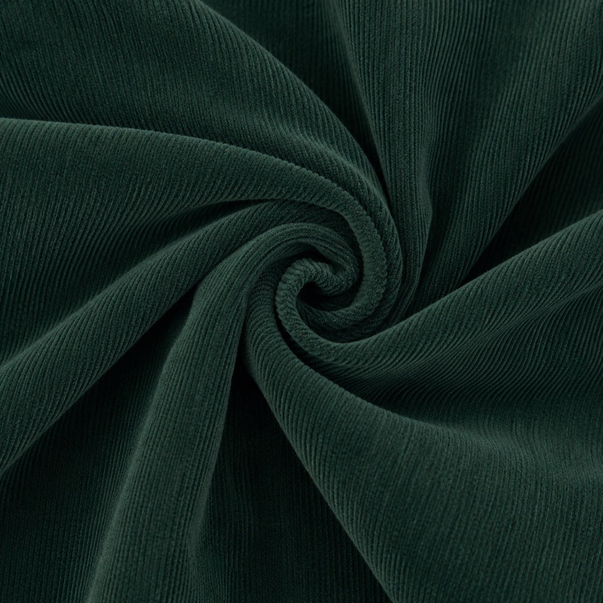 Carriage Boutique dark green cotton corduroy fabric with a soft ribbed texture in a spiral swirl pattern
