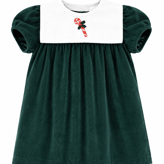 Carriage Boutique dark green corduroy holiday dress for girls with a white bib and candy cane embroidery.