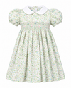 Carriage Boutique toddler girl dress in green floral print with short puff sleeves, white collar, and smocked bodice.