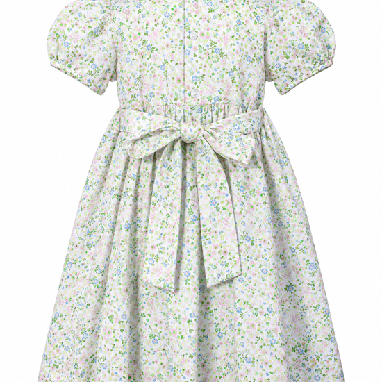 Carriage Boutique toddler girl dress with green floral print, puff sleeves, white collar, and back waist tie