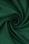 Carriage Boutique dark green silk fabric with a subtle textured finish and elegant swirl drape