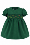 Carriage Boutique green silk baby dress with floral smocking, puffy sleeves, and a Peter Pan collar.