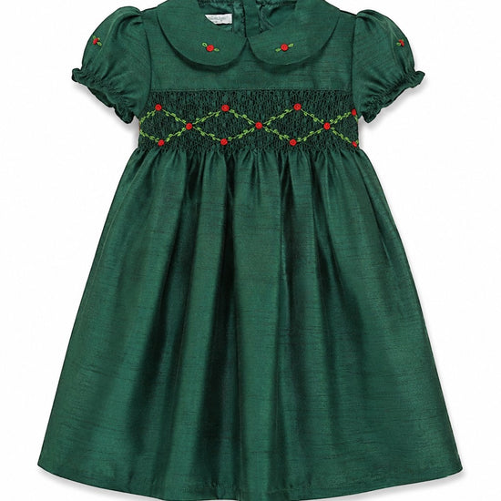 Carriage Boutique green silk toddler dress with smocked chest, Peter Pan collar, and floral embroidery details.