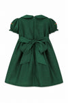 Carriage Boutique green silk toddler dress with Peter Pan collar, puffy sleeves, and a large back bow tie.
