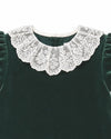 Carriage Boutique green velvet dress featuring an intricate white lace collar and short sleeves.