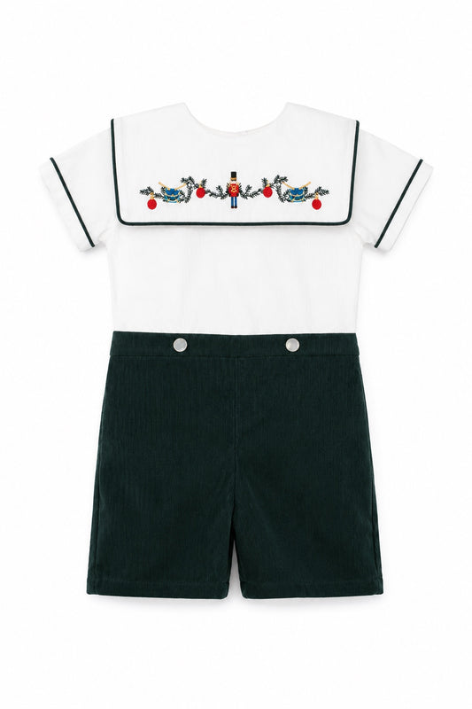 Carriage Boutique infant boy bobbie suit featuring a white shirt with a wooden soldier motif and green corduroy shorts
