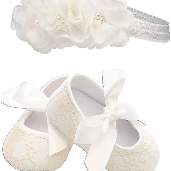 Carriage Boutique ivory lace baby girl baptism shoes with ribbon bows and matching floral headband with pearls.