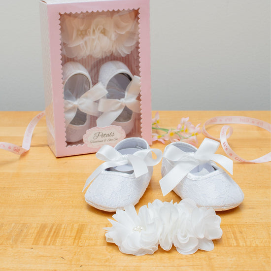 Carriage Boutique ivory lace baby girl baptism shoes with ribbon bows and matching flower headband with pearls.