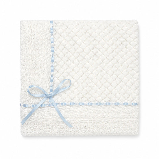Carriage Boutique Julius Berger white baby blanket with delicate Belgium lace and a soft blue ribbon bow.